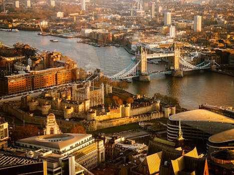 A stunning aerial shot of London showcasing Tower Bridge and the River Thames at sunset.